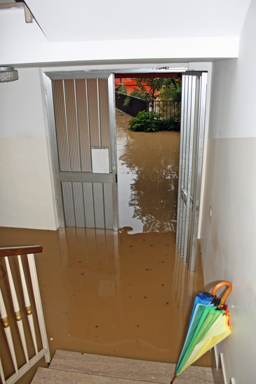 entrance of a House fully flooded during the flooding of the riv